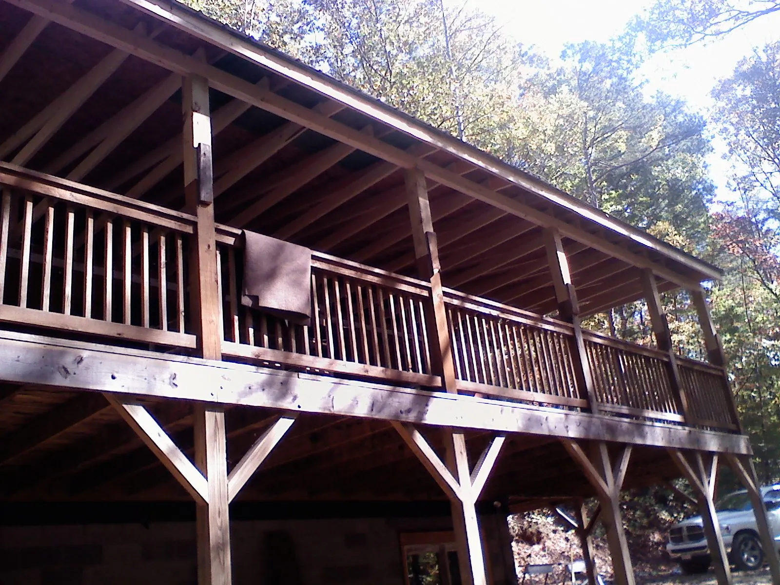 Timber framing under a new elevated porch and deck — Roof Leak Repair in Glen Head by Roofing Brothers